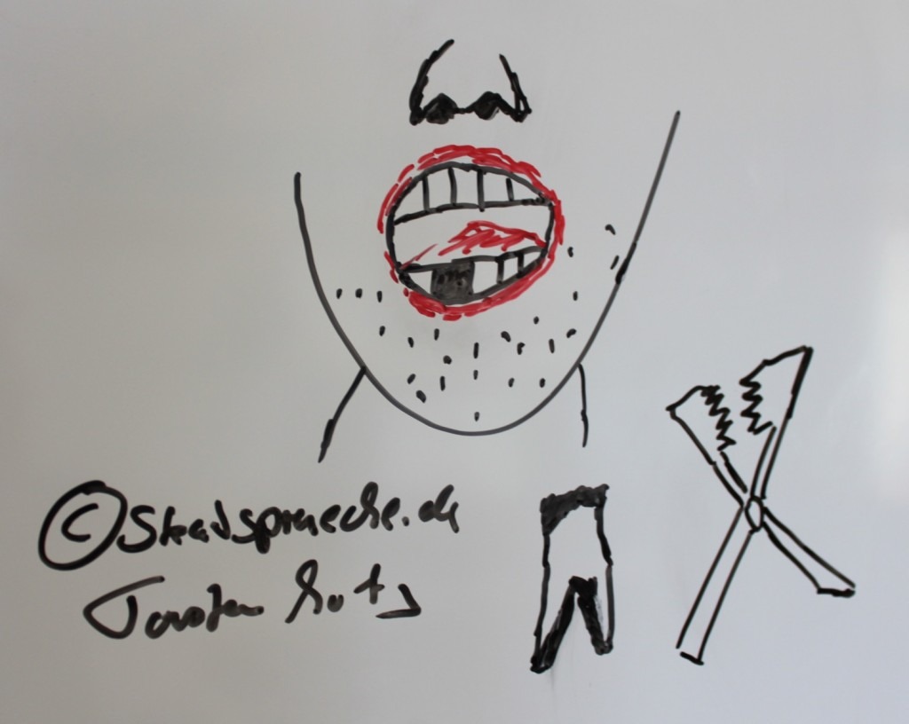 Am Whiteboard gezeichnet: unrasierter Mann mit offenem Mund und faulem Zahn, ein Zahn liegt gezogen daneben mit einer Art Zange vom Zahnarzt